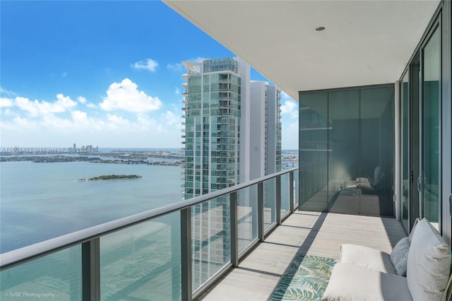 balcony featuring a water view