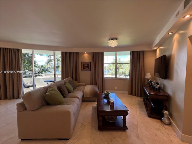 living room featuring light tile flooring