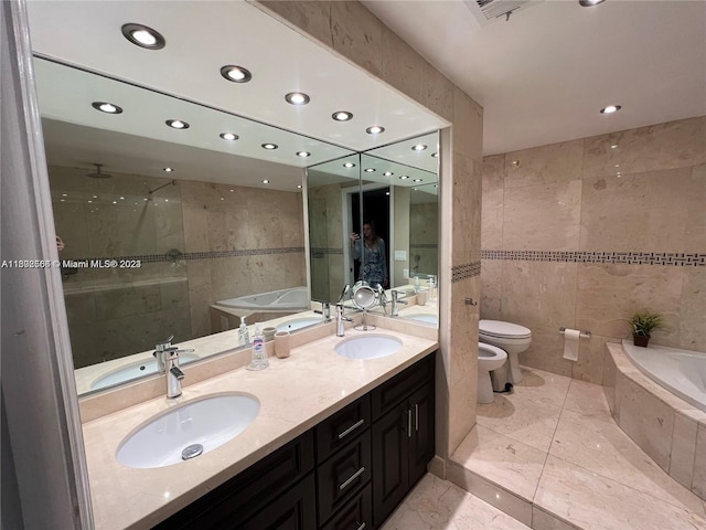 bathroom with a sink, tile walls, and a bath