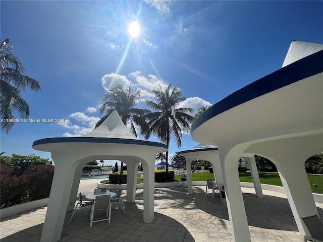 view of home's community featuring a pool, a patio area, and a gazebo