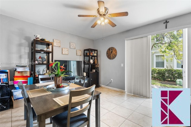 tiled dining space with ceiling fan