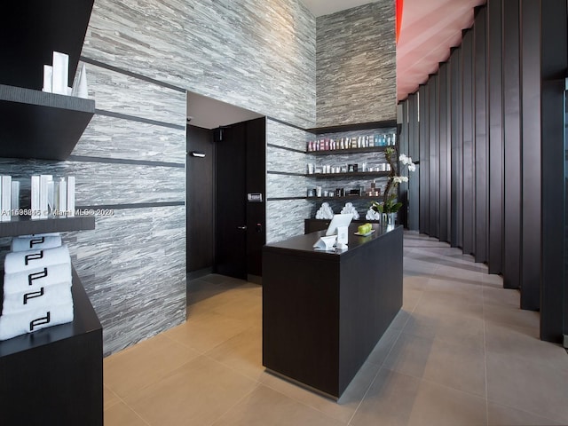 bar featuring light tile patterned floors