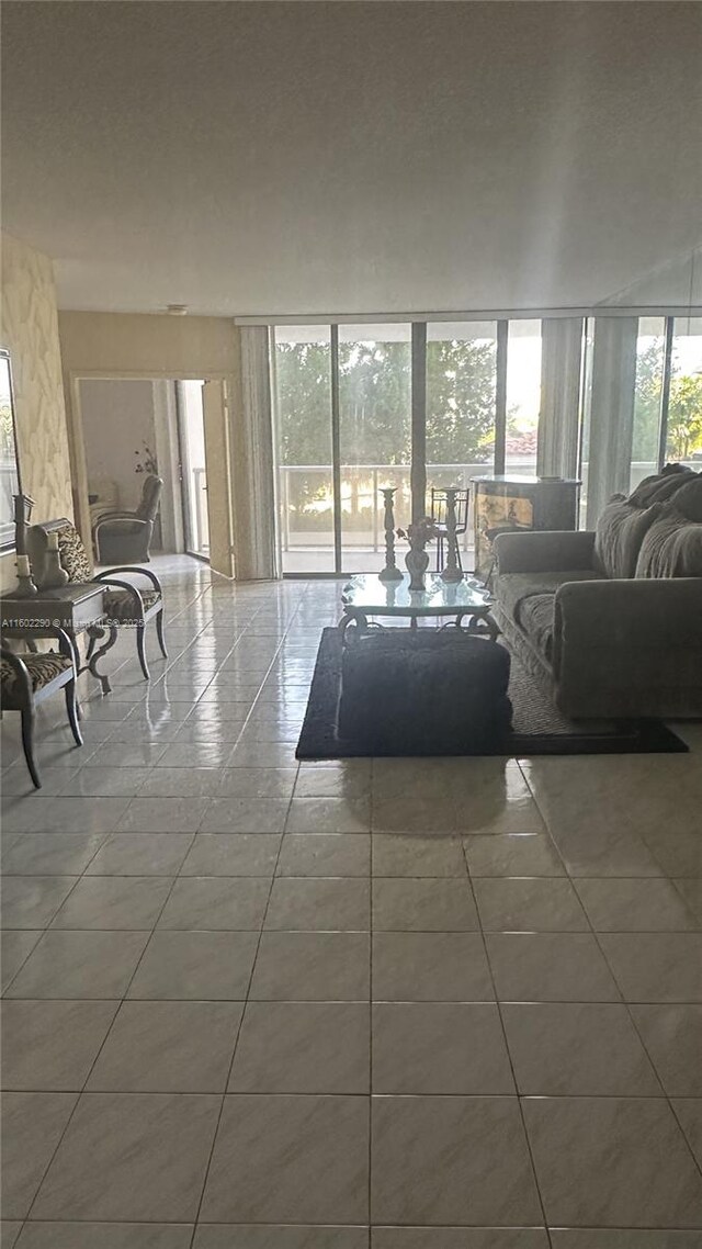 tiled living room with a healthy amount of sunlight