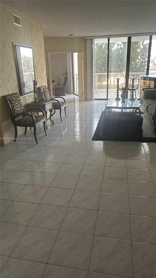 unfurnished living room featuring tile patterned flooring