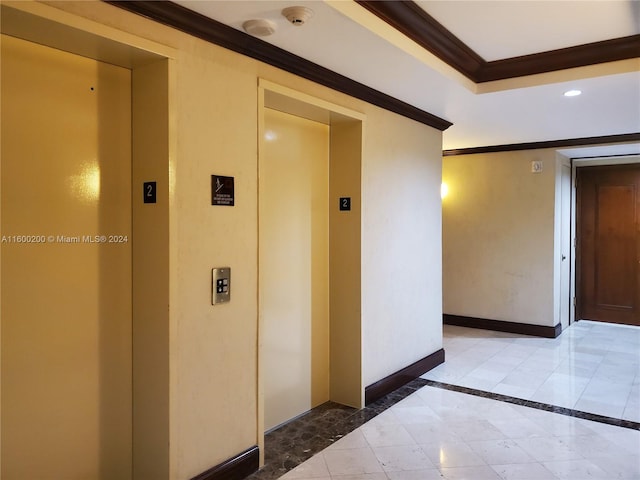 hallway featuring tile patterned flooring, elevator, and ornamental molding