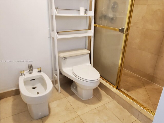 bathroom with tile patterned flooring, a bidet, walk in shower, and toilet