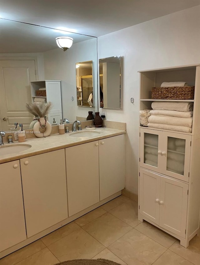 bathroom with tile patterned flooring and vanity