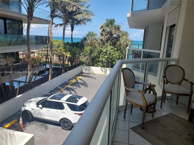 balcony featuring a water view