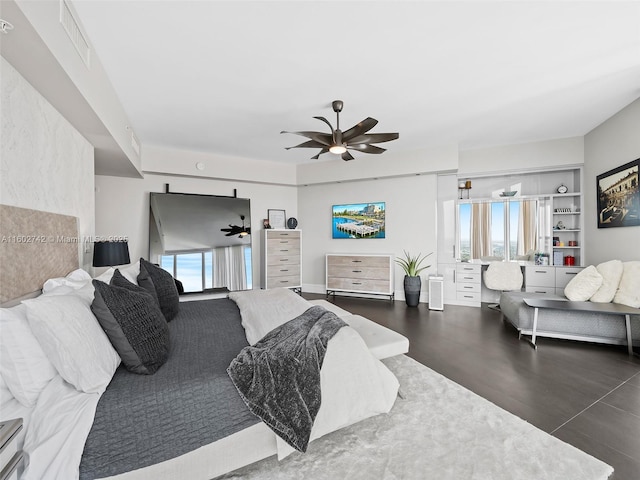 bedroom with multiple windows and ceiling fan