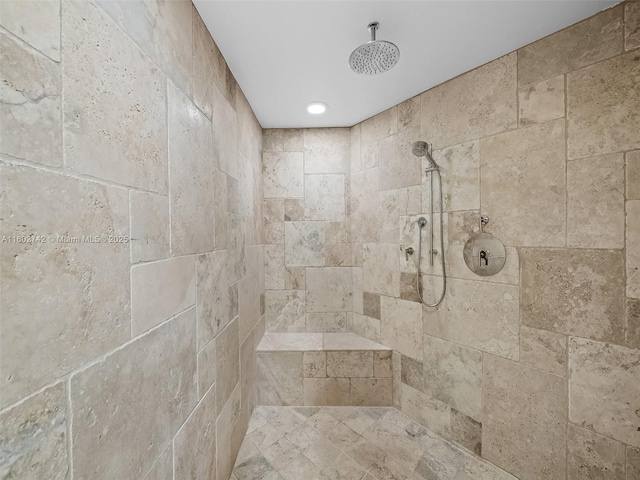 bathroom with tiled shower