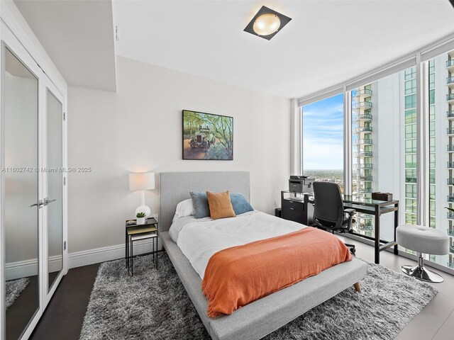 bedroom featuring a wall of windows