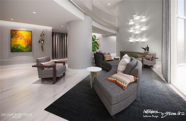 living room with decorative columns and hardwood / wood-style floors