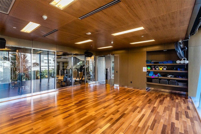 interior space with wood ceiling and wood-type flooring