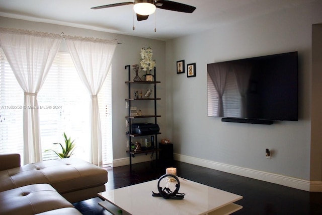 living room featuring dark hardwood / wood-style floors and ceiling fan