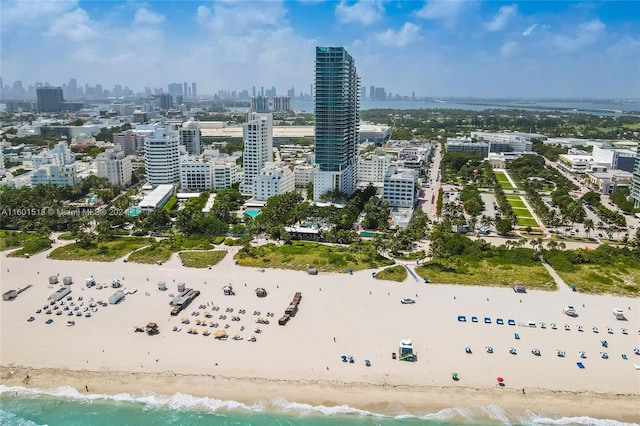 bird's eye view with a beach view and a water view