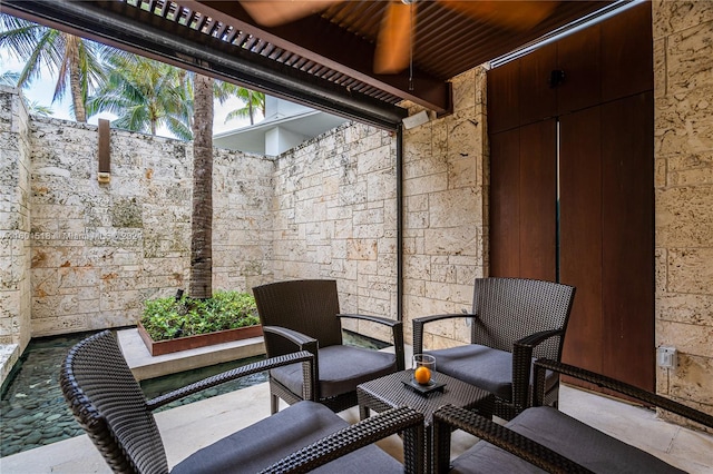 view of patio / terrace featuring ceiling fan