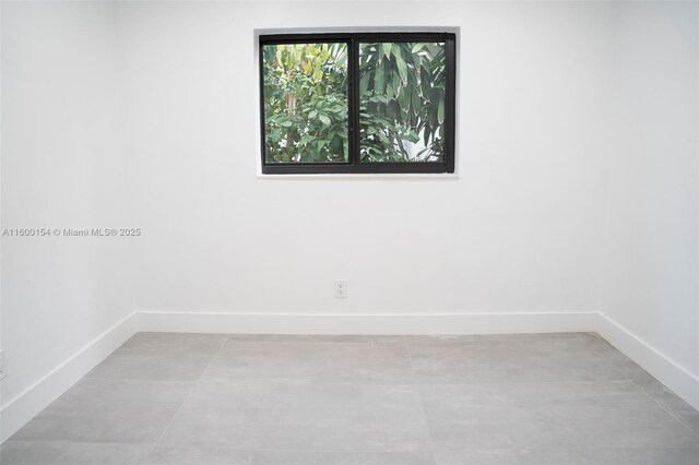 unfurnished bedroom featuring a closet and light tile patterned floors