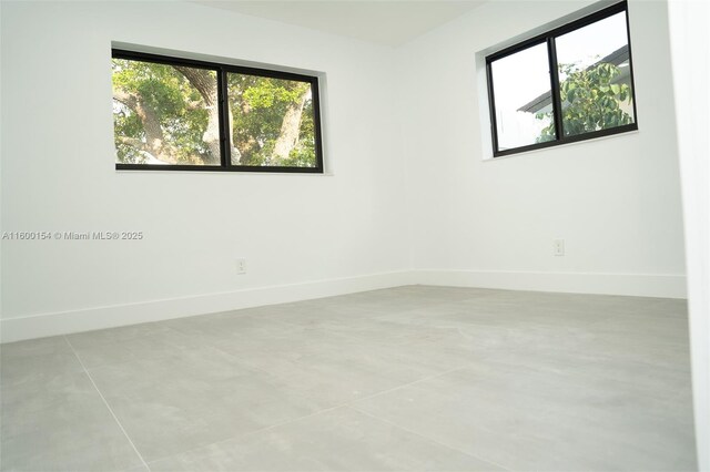 unfurnished bedroom with a closet and light tile patterned floors