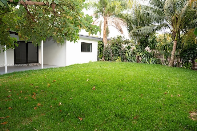 rear view of house with a yard and central AC