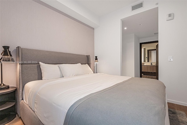 bedroom featuring hardwood / wood-style flooring