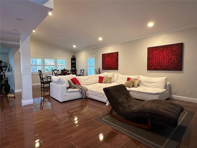 living room with dark hardwood / wood-style floors, ornamental molding, and vaulted ceiling