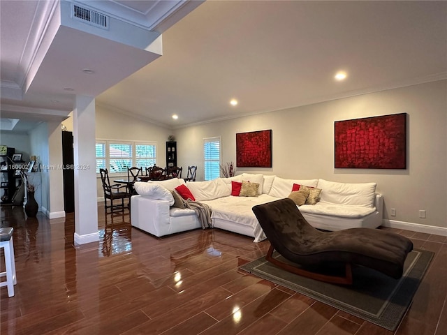 living room featuring ornamental molding, dark hardwood / wood-style floors, and lofted ceiling