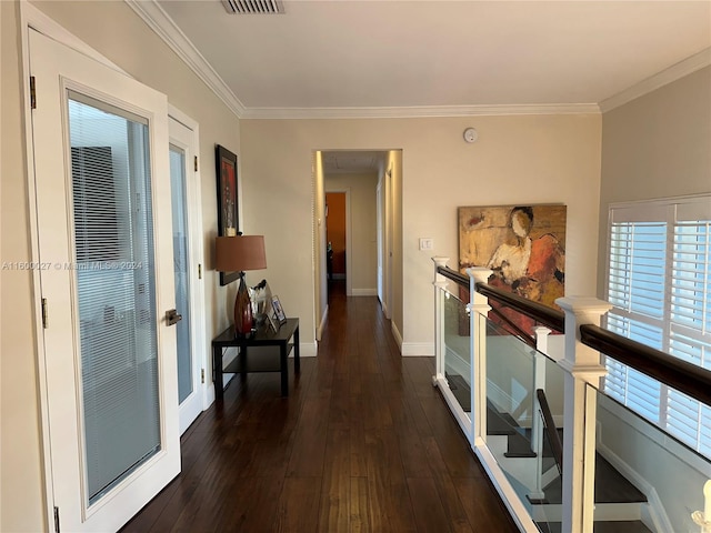 corridor featuring ornamental molding and dark hardwood / wood-style flooring