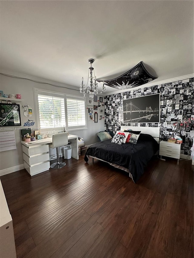 bedroom featuring a notable chandelier, ornamental molding, and dark wood-type flooring