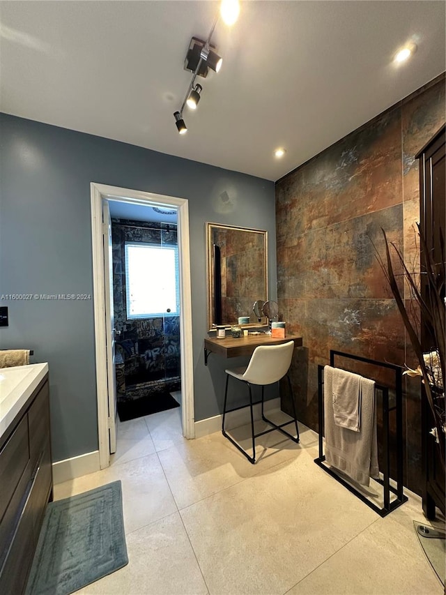 bathroom with vanity and rail lighting