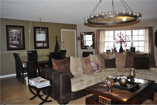 living room with an inviting chandelier