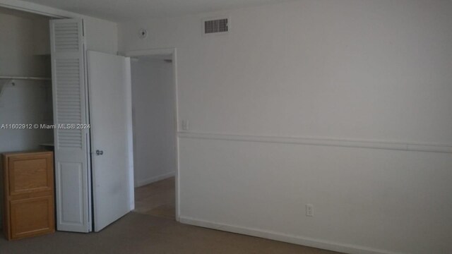 unfurnished bedroom featuring a closet