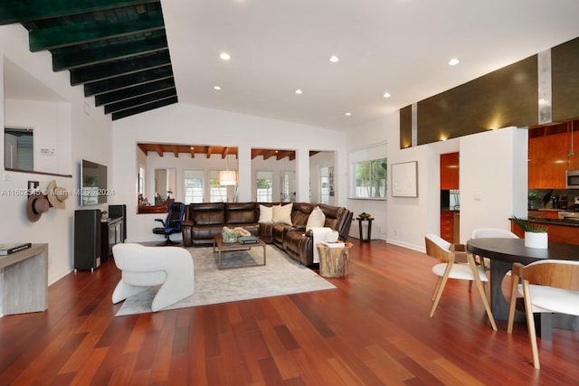 living room featuring wood-type flooring and high vaulted ceiling