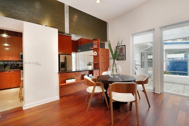 dining room with hardwood / wood-style floors