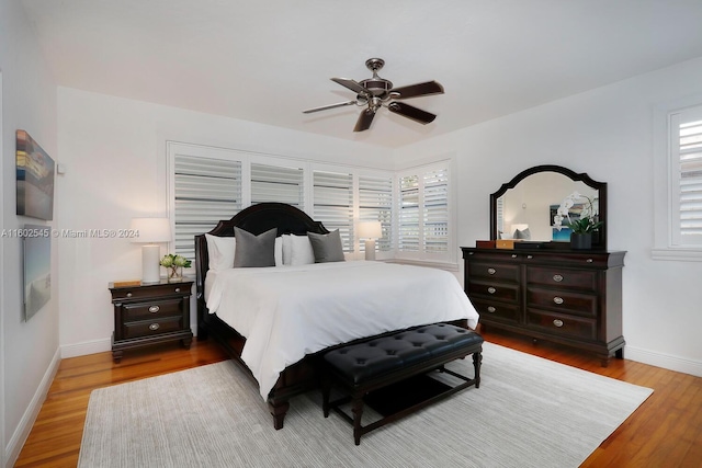 bedroom featuring ceiling fan and light hardwood / wood-style floors