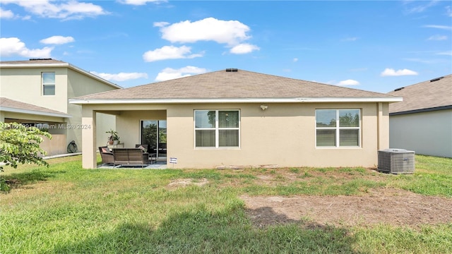 back of property featuring an outdoor living space, central AC unit, a lawn, and a patio