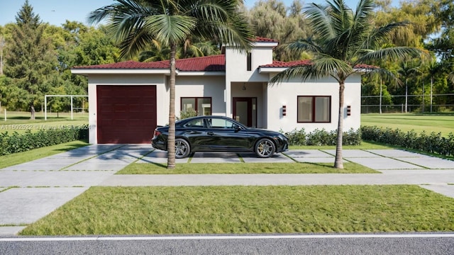 view of front facade featuring a garage and a front yard