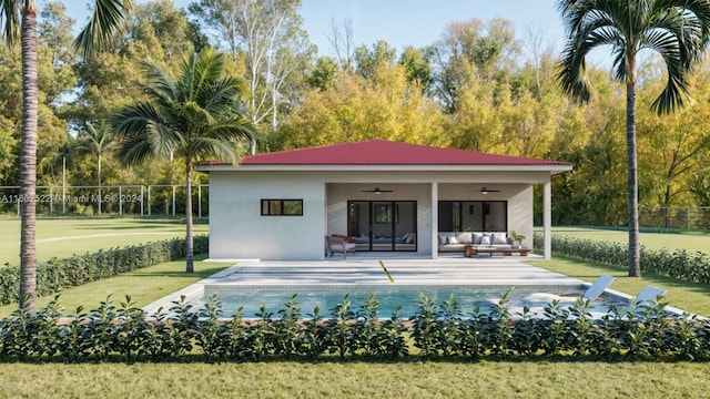 back of property with a patio, a fenced in pool, a lawn, ceiling fan, and outdoor lounge area