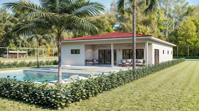 view of swimming pool featuring a patio area, a lawn, and ceiling fan