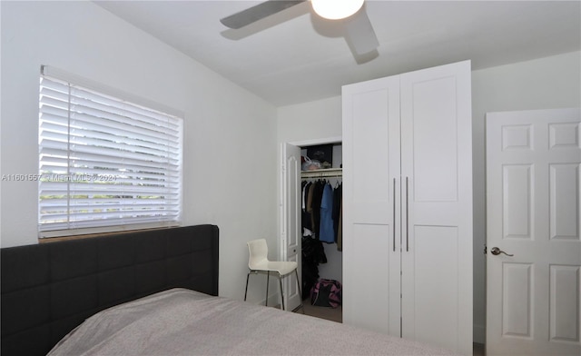 bedroom featuring ceiling fan and a closet