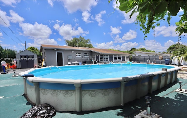 view of pool featuring a storage shed