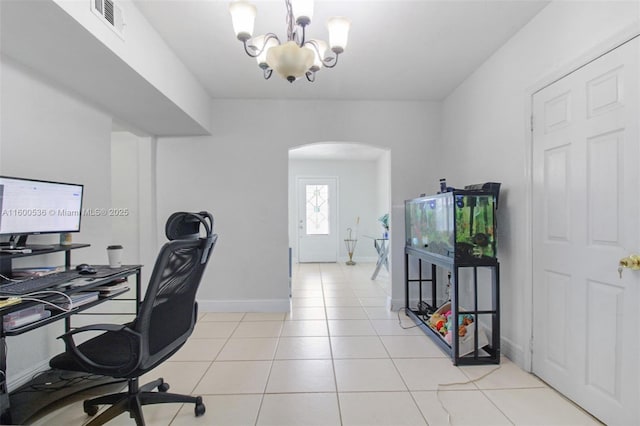 office area with visible vents, a notable chandelier, arched walkways, light tile patterned floors, and baseboards