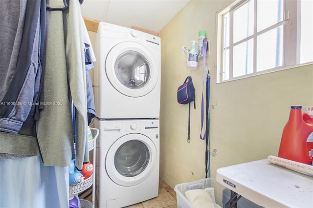 laundry area featuring laundry area and stacked washer and dryer