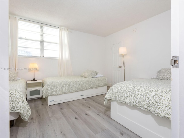 bedroom with wood-type flooring