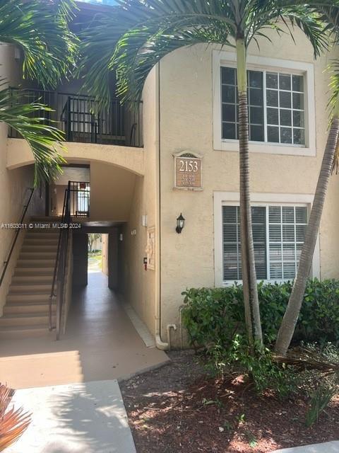 doorway to property featuring a carport