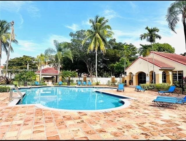 view of swimming pool featuring a patio