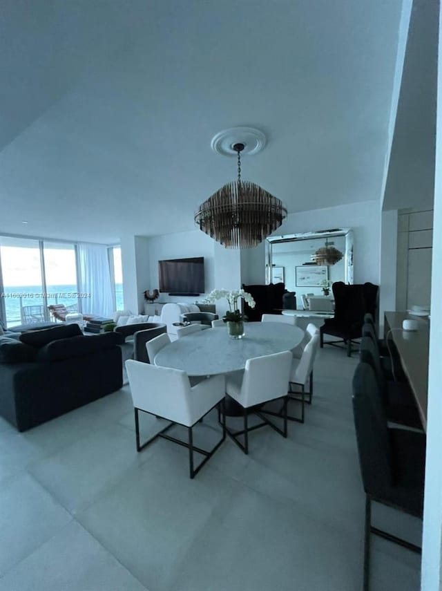 dining space featuring a notable chandelier