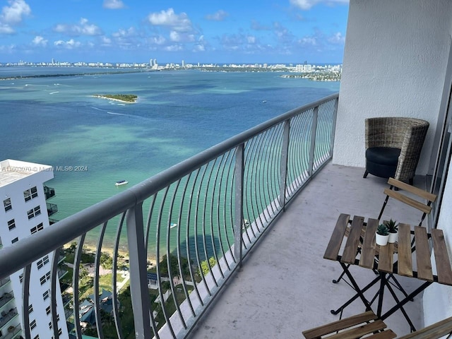 balcony featuring a water view