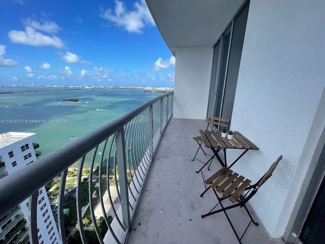 balcony featuring a water view