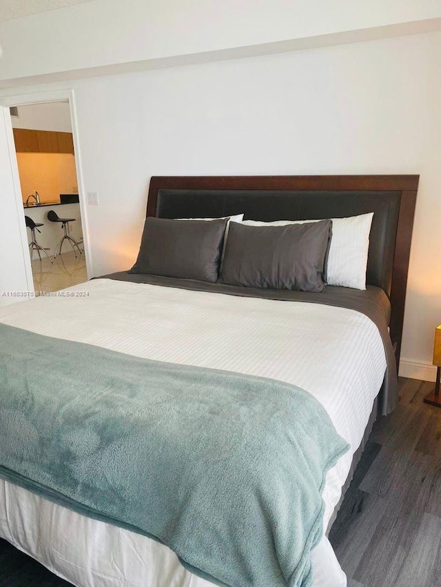 bedroom featuring dark wood-type flooring