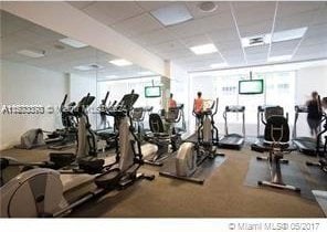 workout area featuring a paneled ceiling